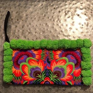 Vibrant Embroidered Pom-Pom Clutch with Bright Floral Motif
